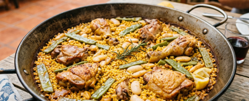 Pan of chicken paella with green beans and white beans
