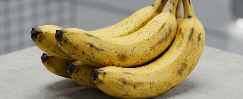 3D rendered ripe bananas resting on a concrete block